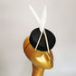 black sinamay pillbox hat with 2 floating feathers on mannequin head